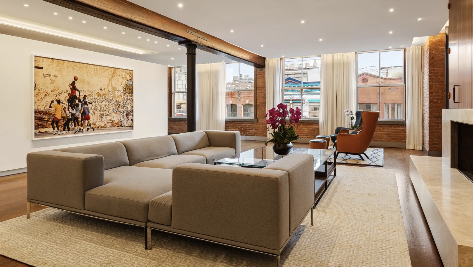 A Manhattan loft with exposed brick, timber beams and sunlit living spaces